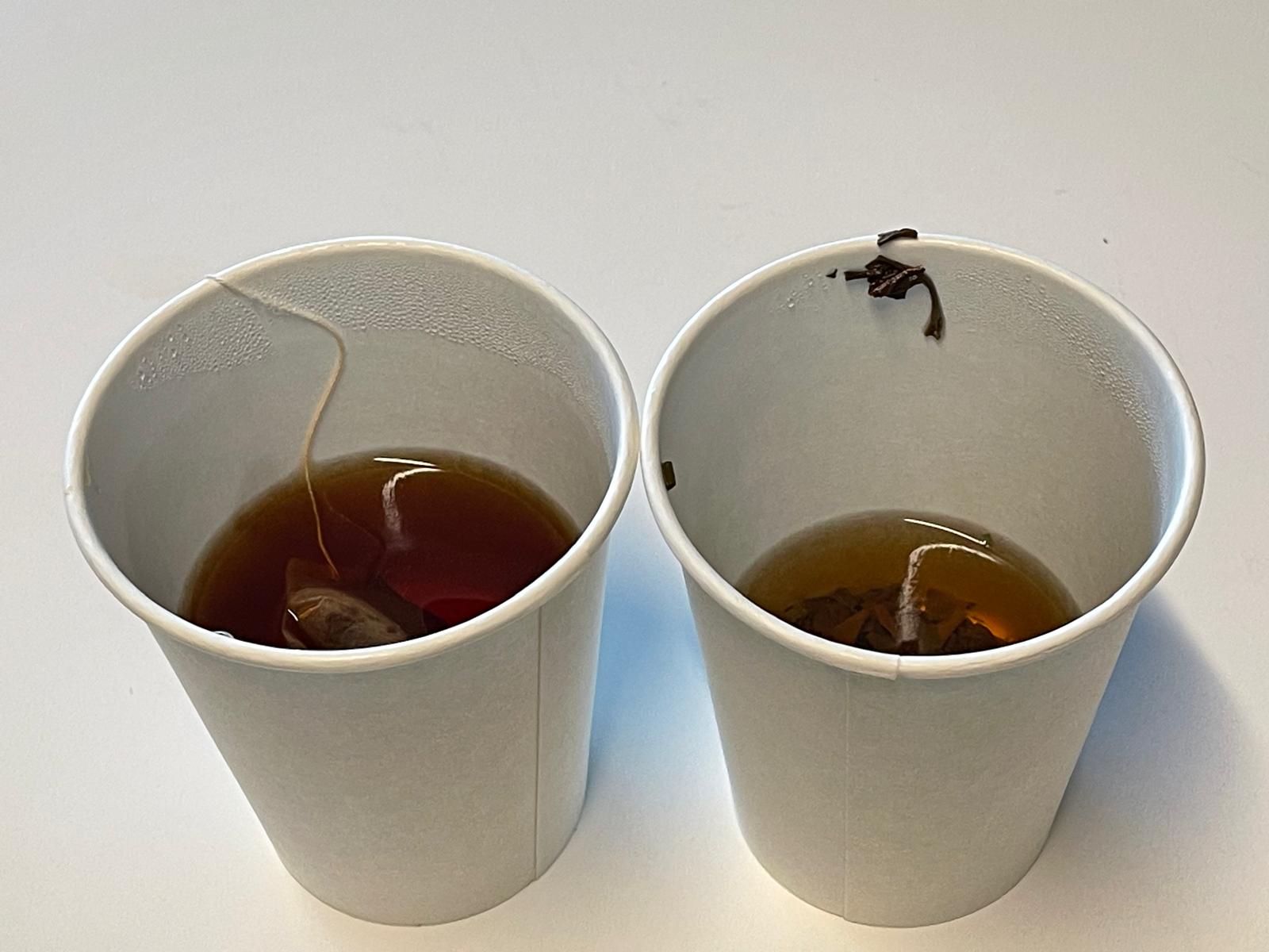 The end - both cups of tea mostly drained, with the loose leaf tea cup on the right drained a bit further.